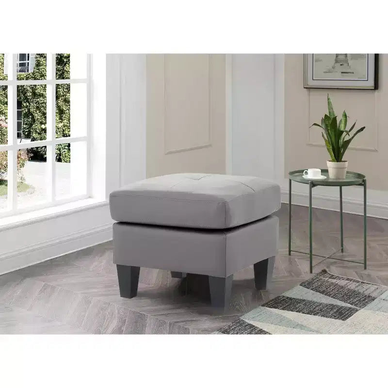 Ottoman capitonné en similicuir